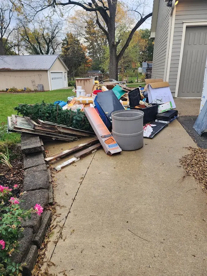 Dumpster being loaded with debris for Demolition Dumpster Rental in Samsula-Spruce Creek